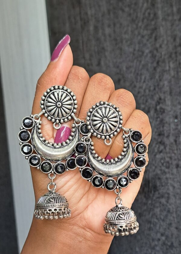 Nayra Oxidised Earrings with crescent designs, black stones, and jhumkas.