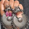 Pair of Sawan Special Trishul Oxidised Earrings featuring intricate trishul motifs, detailed craftsmanship, and dangling bells.