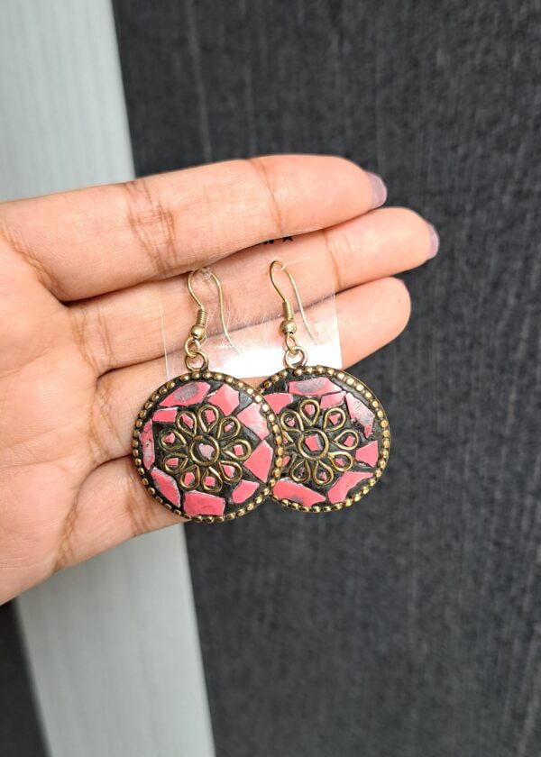 Vritika Pink Earrings with round design, pink mother-of-pearl, golden accents, and floral detailing.