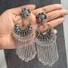 Elegant silver-look chandelier earrings with beautiful design and dangling chains.