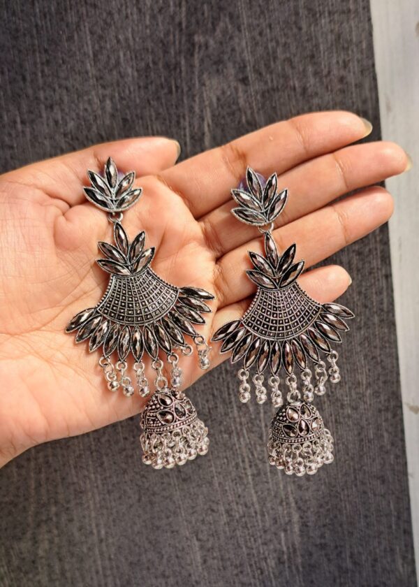 Oxidised Jhumka Earrings featuring a fan-shaped design with intricate leaf patterns and a classic jhumka adorned with tiny ghungroo-style beads.