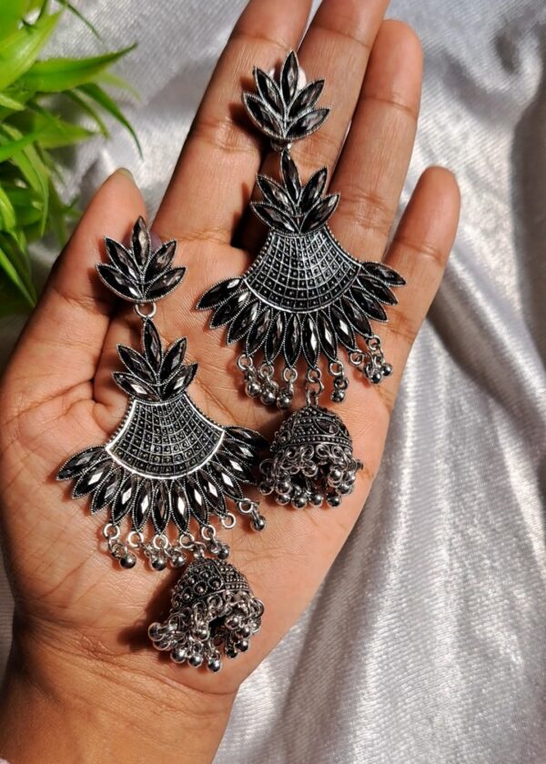 Oxidised Jhumka Earrings featuring a fan-shaped design with intricate leaf patterns and a classic jhumka adorned with tiny ghungroo-style beads.