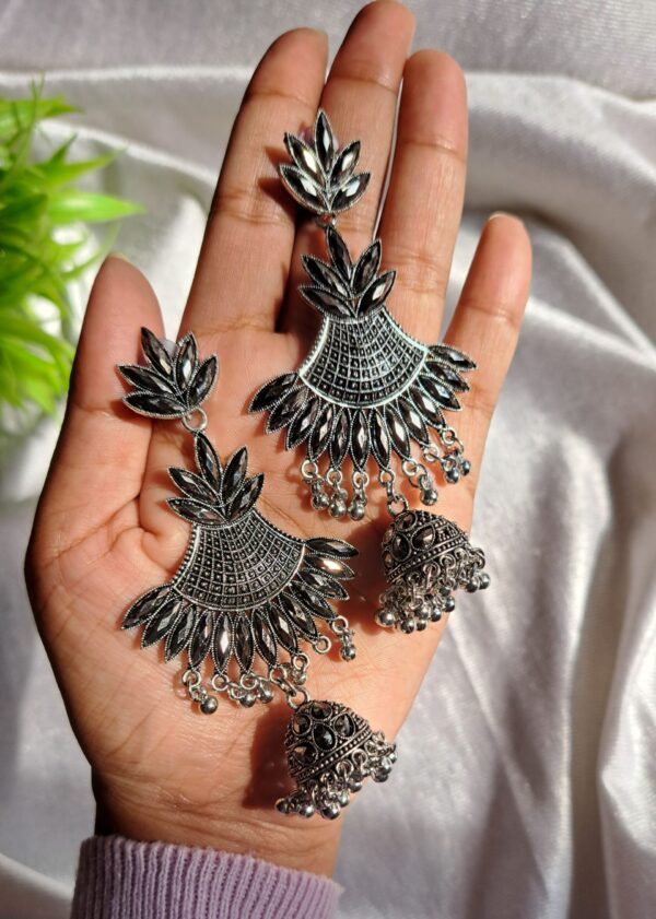 Oxidised Jhumka Earrings featuring a fan-shaped design with intricate leaf patterns and a classic jhumka adorned with tiny ghungroo-style beads.