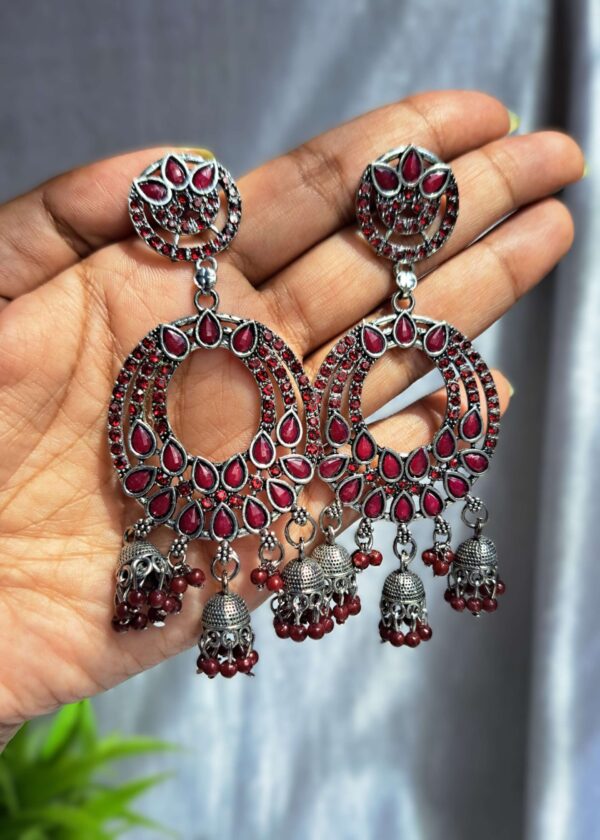 Gulnaar Pink Oxidised Earrings Jhumka with deep pink stones and oxidised silver finish, offering a bold and traditional look.