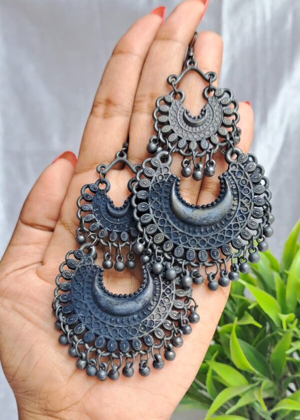 Crescent-shaped oxidised earrings with intricate detailing, inspired by traditional Indian craftsmanship.