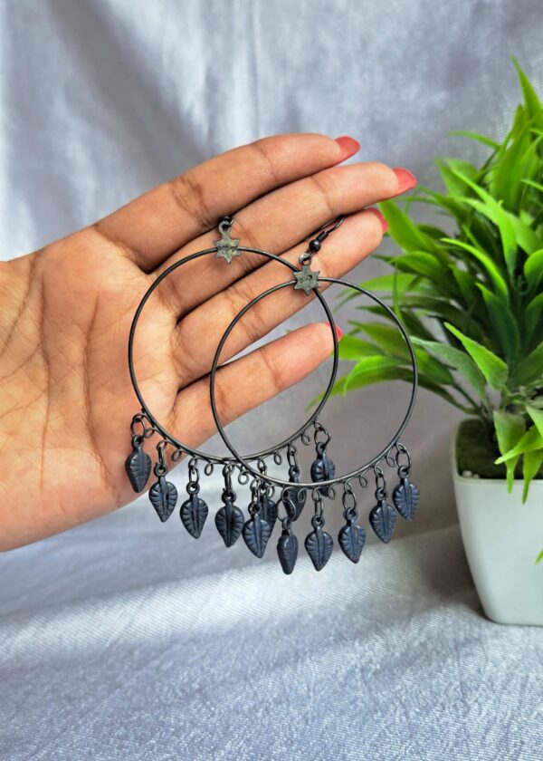 Ultra-light oxidised earrings with leaf charms and vintage design.