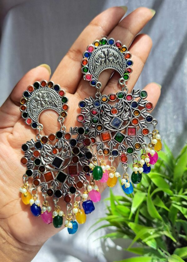 Multicolour oxidised earrings with rainbow stones and dangling beads.